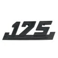 W0983 a - Emblemat WSK pokrywy 175 plastik czarny.webp